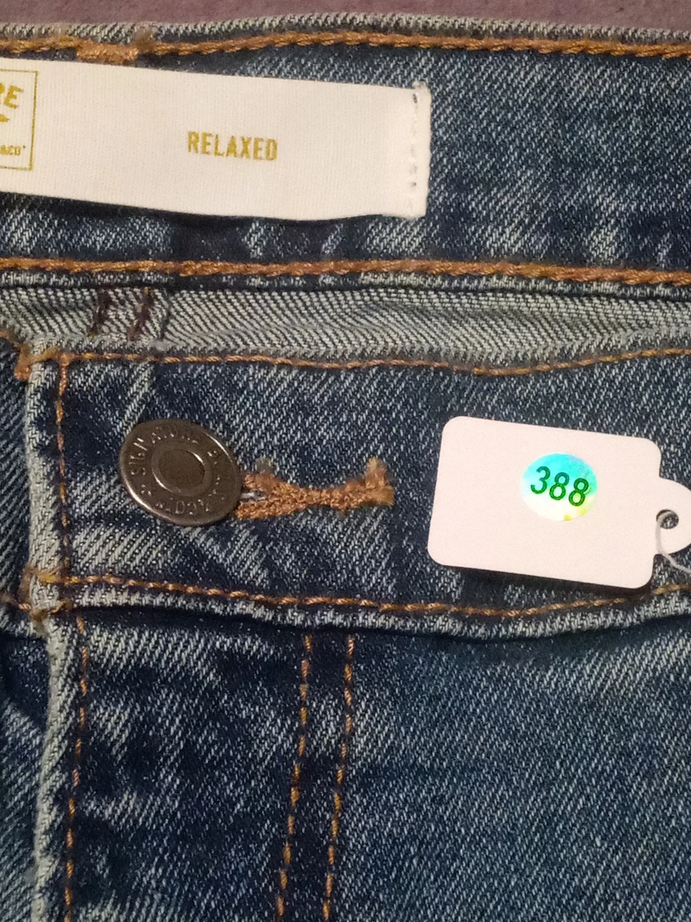 Levi's Signature Relaxed Fit Jeans in Blue with Brown Patch
